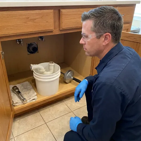 HCL Plumbing technician providing clogged drain repair in New York, NY
